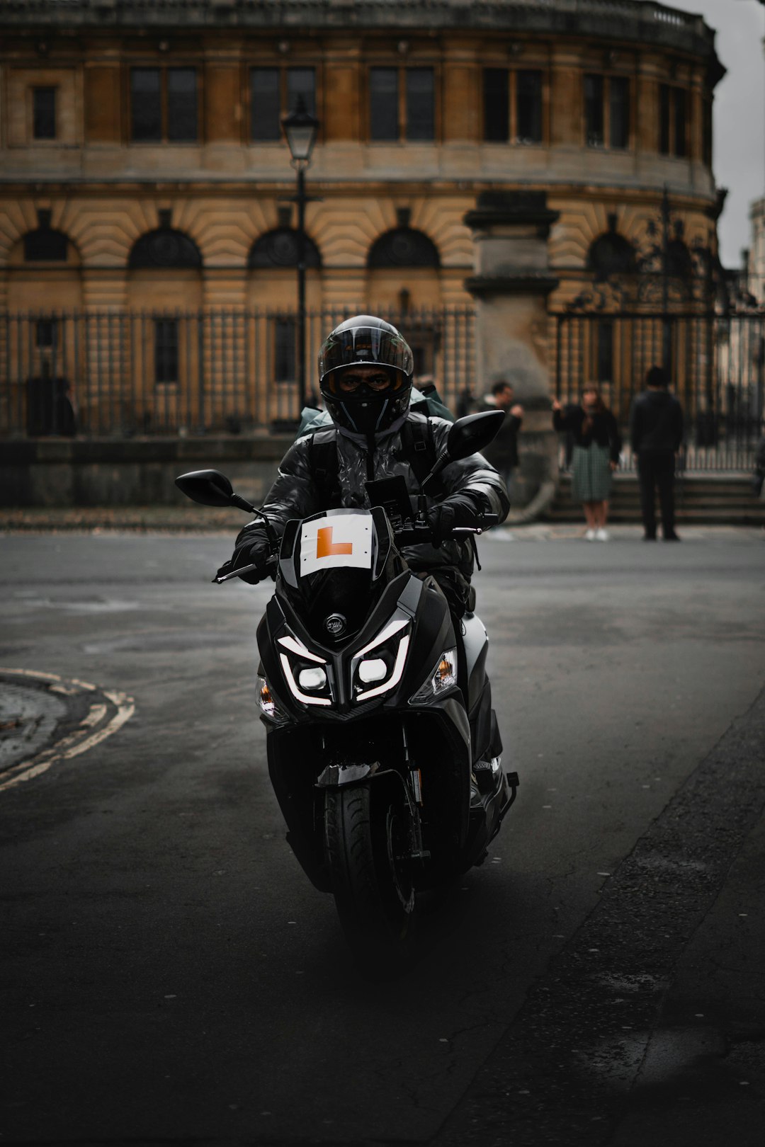 a-person-riding-a-motorcycle-on-a-city-street-y8bvtqpnjeq