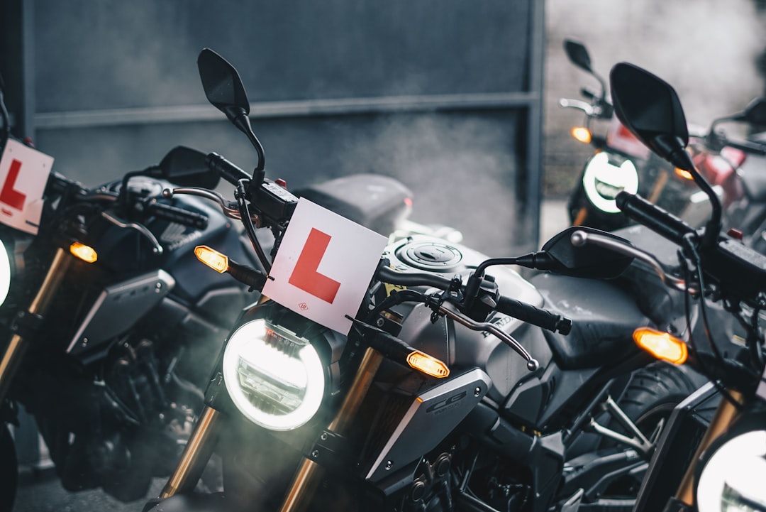 black-motorcycle-parked-beside-wall-bejtriu6kgm